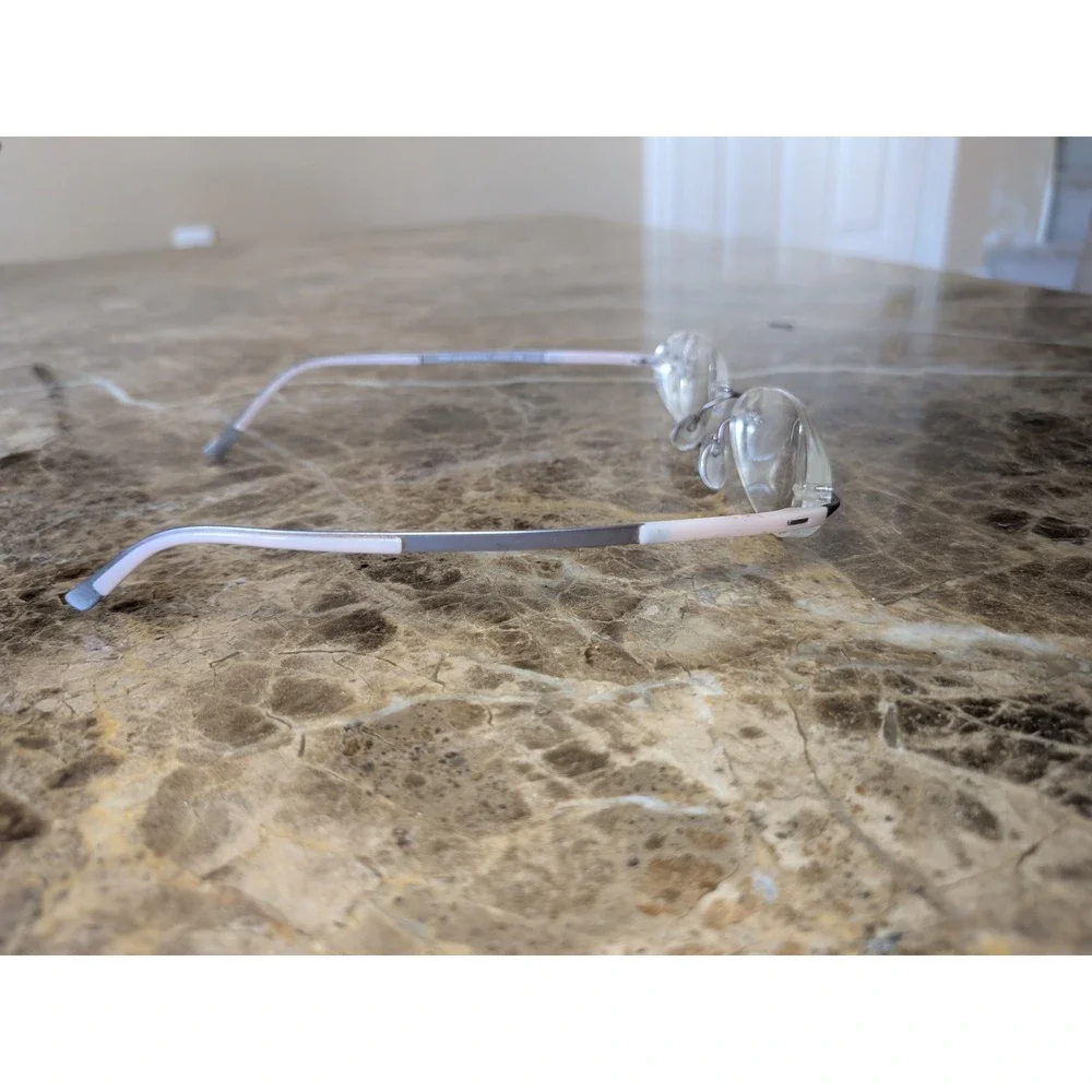 Silhouette Eyeglasses 4476 40 6053 52[]17 135 5416 Titan Creme Rimless Austria